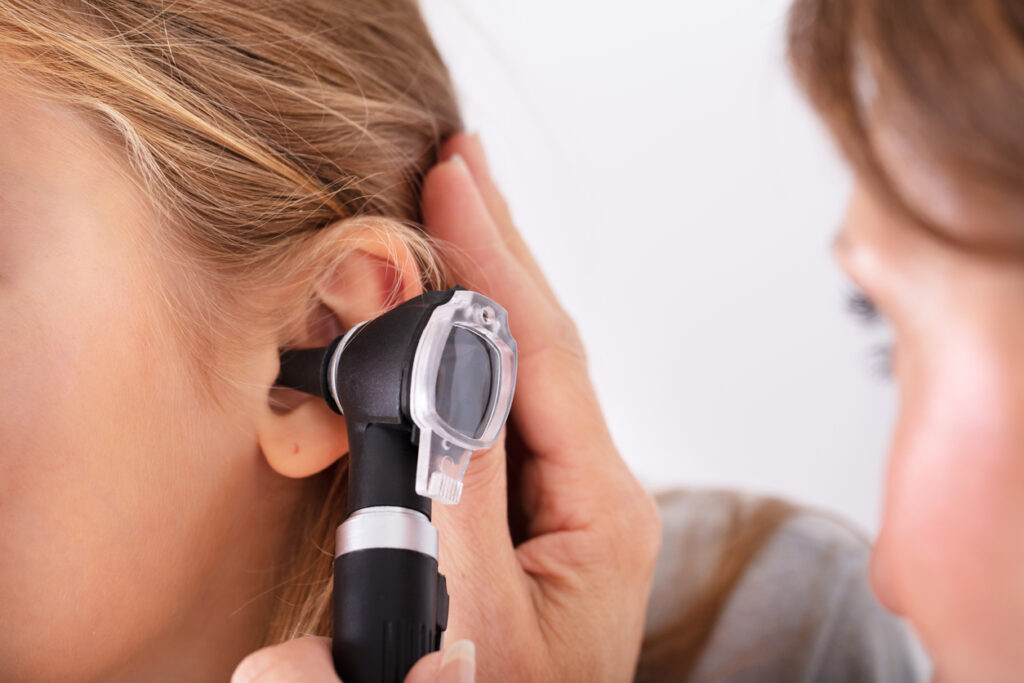 Doctor Checking Girl's Ear